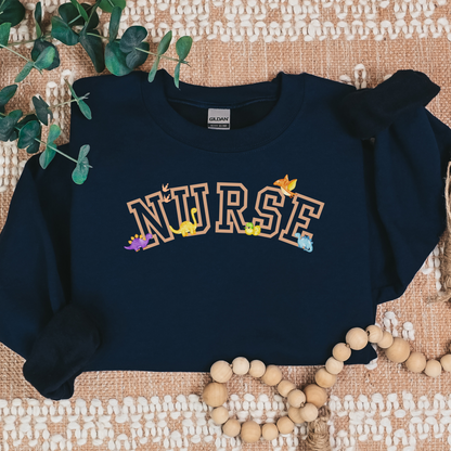 Dinosaur-Nurse-Varsity-Tan-Cozy Sweatshirt