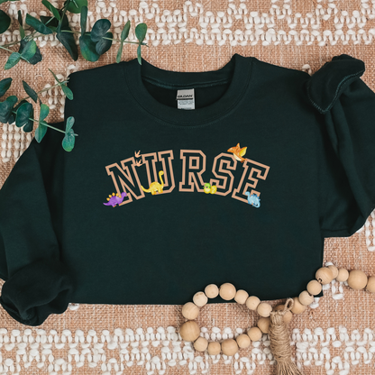 Dinosaur-Nurse-Varsity-Tan-Cozy Sweatshirt