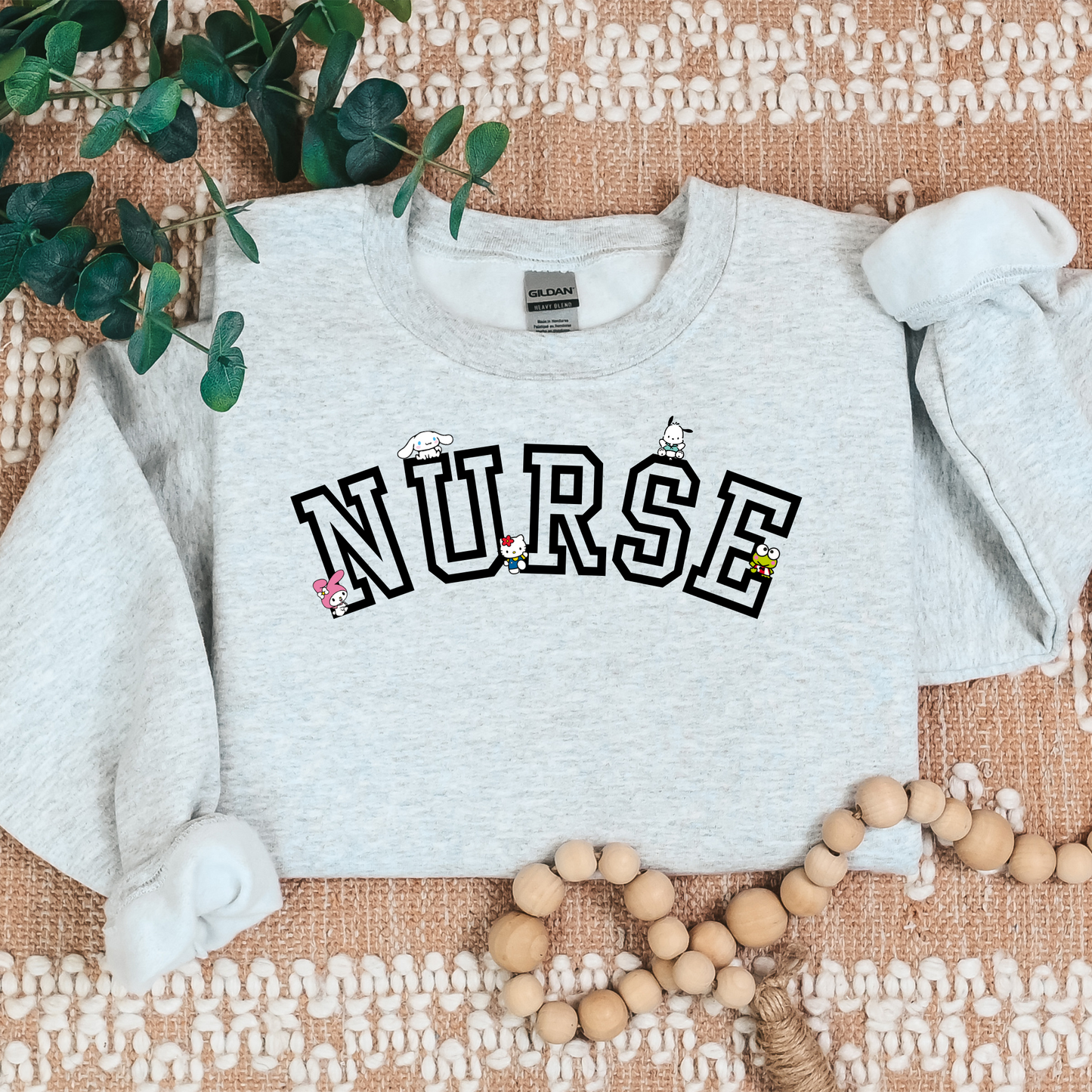 Black-NURSE-Varsity- Kawaii-Characters -Cozy Sweatshirt