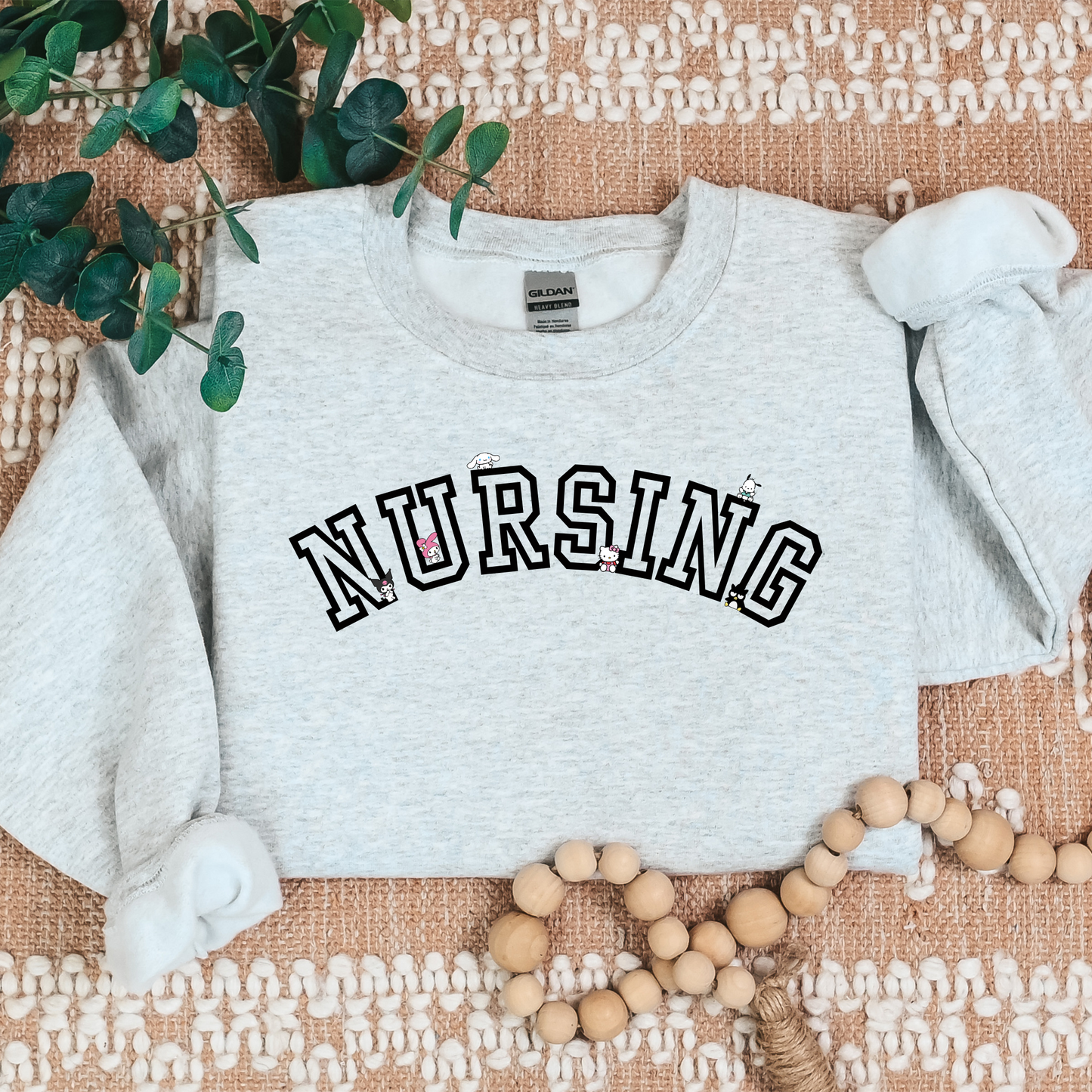 Black-NURSING-Varsity- Kawaii-Characters -Cozy Sweatshirt