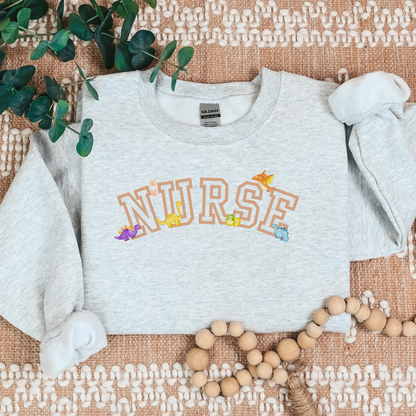 Dinosaur-Nurse-Varsity-Tan-Cozy Sweatshirt