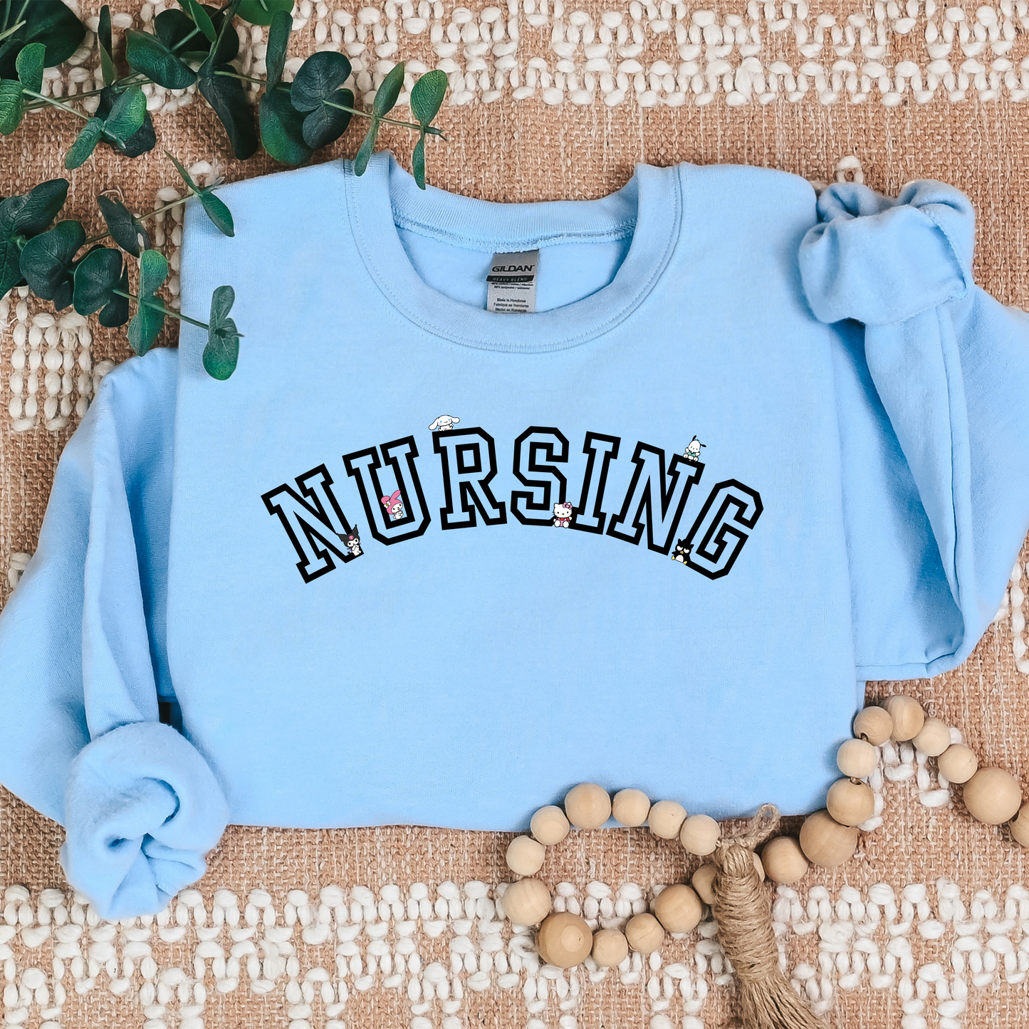 Black-NURSING-Varsity- Kawaii-Characters -Cozy Sweatshirt