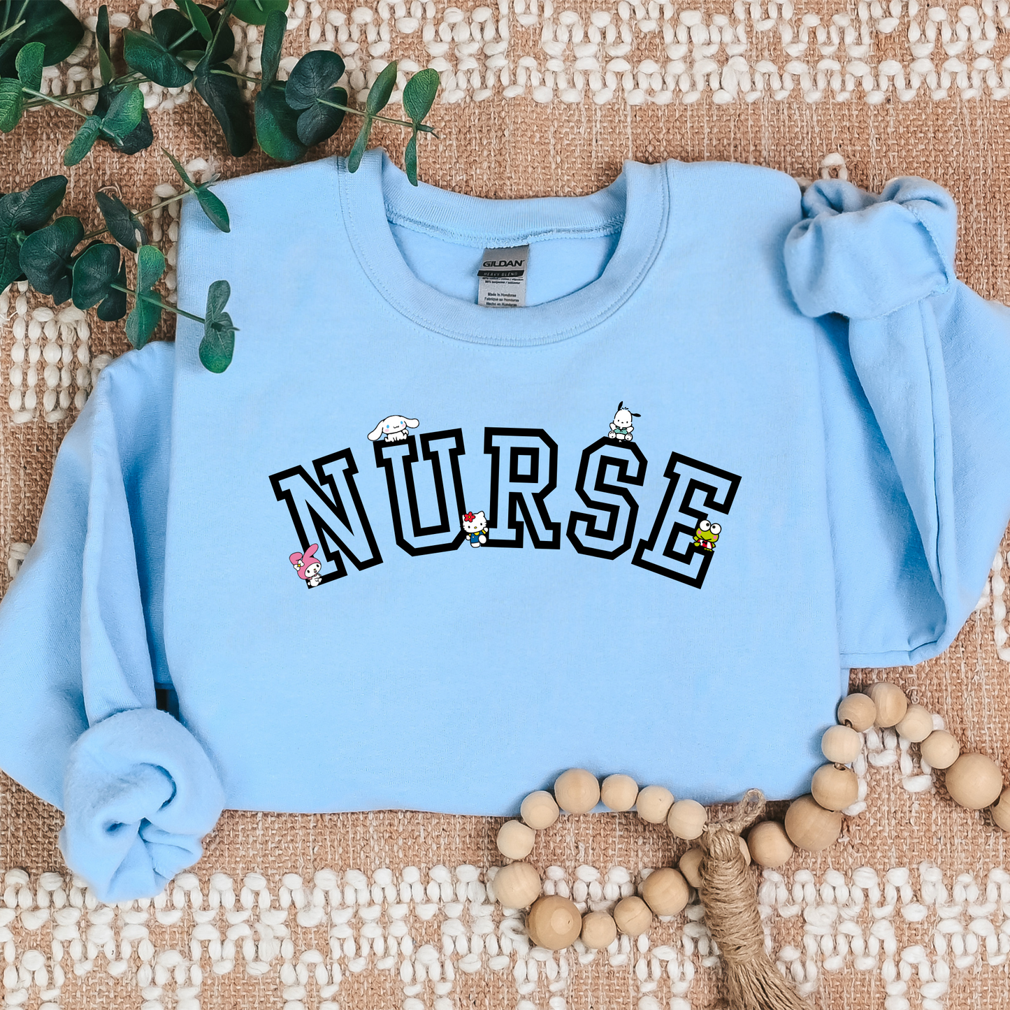 Black-NURSE-Varsity- Kawaii-Characters -Cozy Sweatshirt