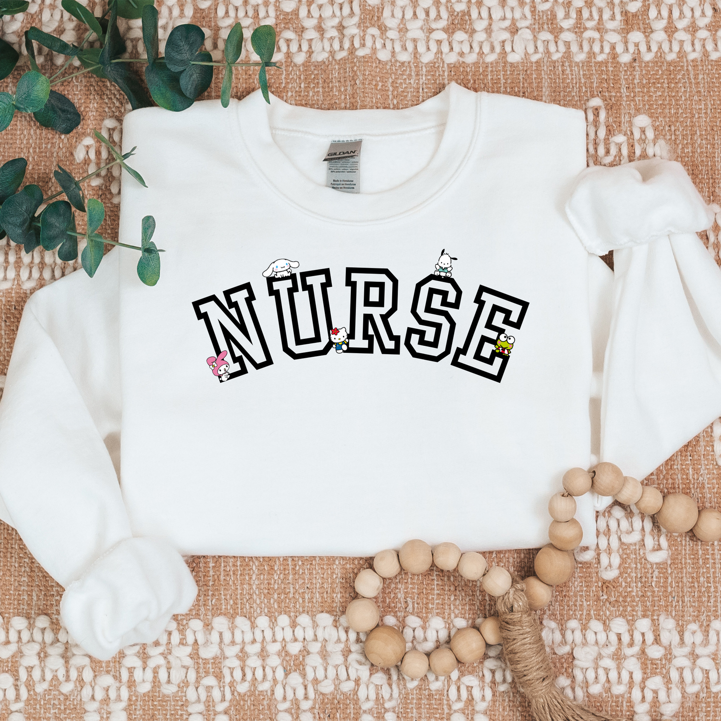 Black-NURSE-Varsity- Kawaii-Characters -Cozy Sweatshirt