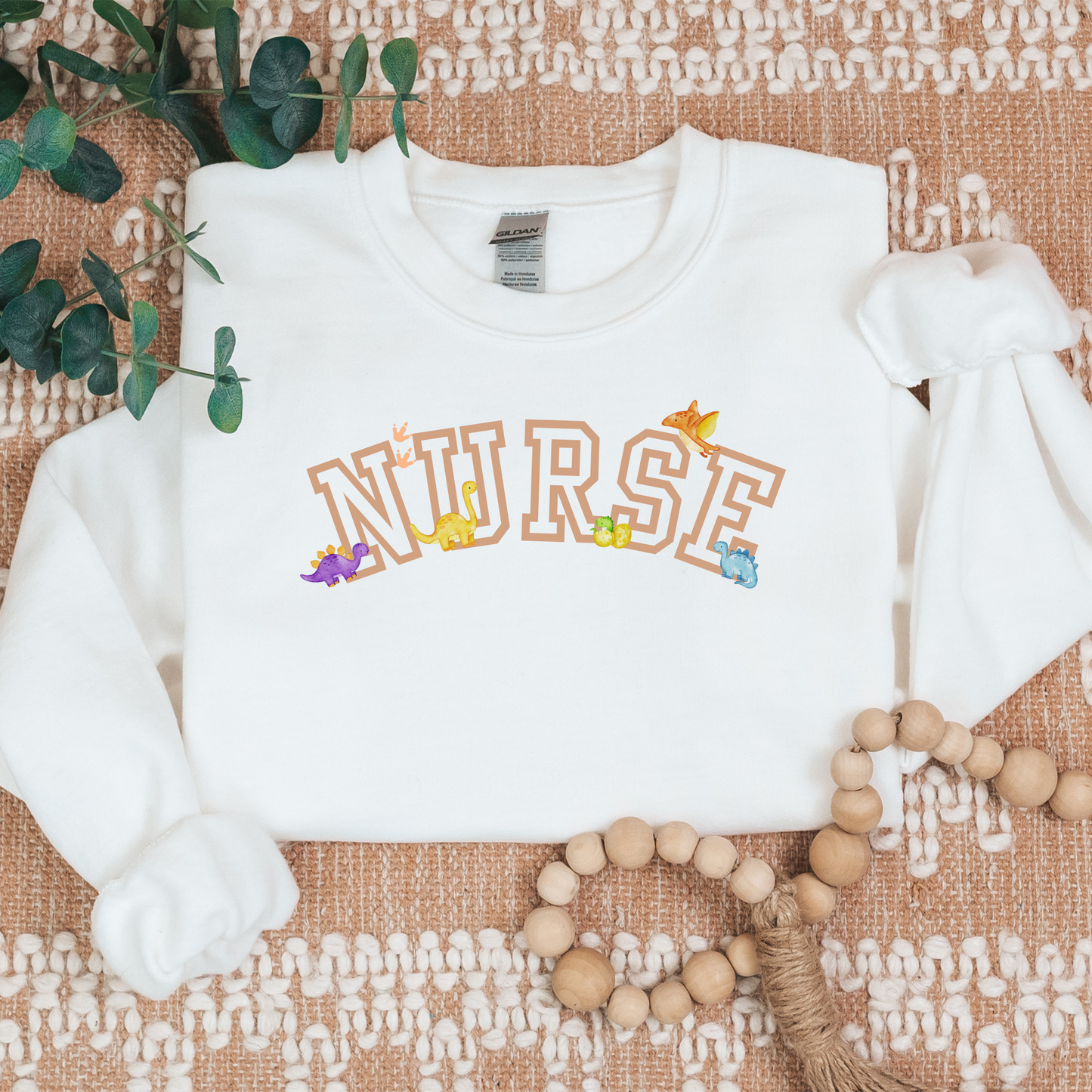 Dinosaur-Nurse-Varsity-Tan-Cozy Sweatshirt