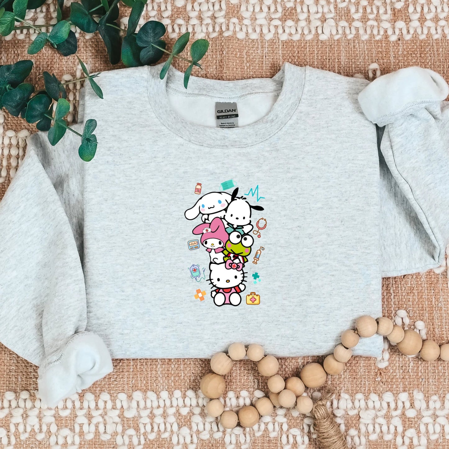 Stacked Medical Kitty and Friends Cozy Sweater