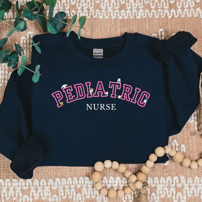 Pink- Varsity- Pediatric Nurse- Kawaii-Characters -Cozy Sweatshirt